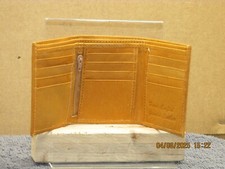 The listing is :A hand crafted genuine leather light tan credit card tri-fold.