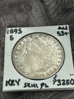 AU++, KEY 1895-S MORGAN DOLLAR.  Nicely toned, Semi-PL Fields. Light even wear.