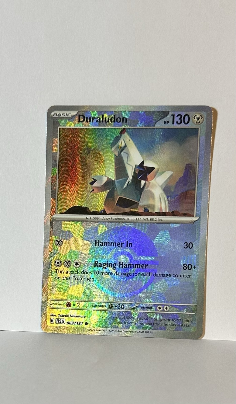DURALUDON 069/131 PRISMATIC EVOLUTION POKEMON (POKE BALL HOLO, NM)
