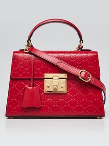 small red bag with handle