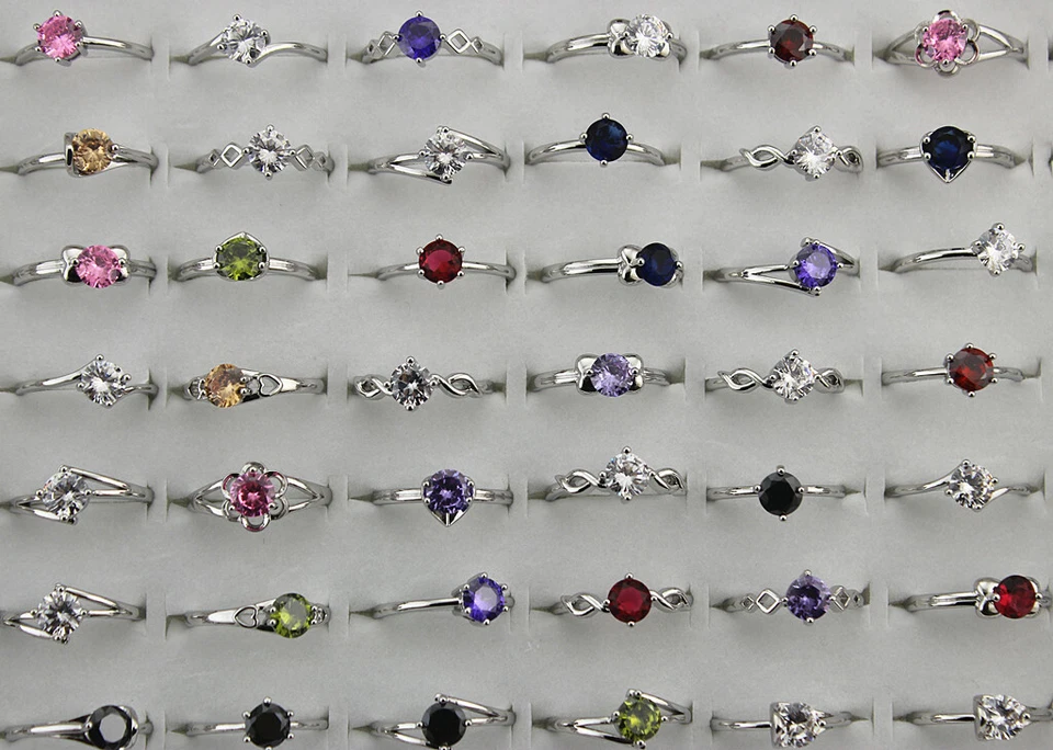 Venta al por mayor lotes mixtos 32 piezas dijes circonitas cúbicas anillos de boda ajustables para dama Foto 2 de 4