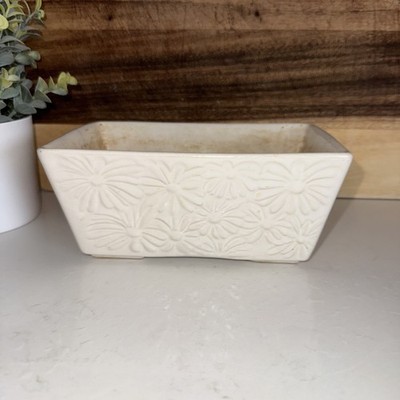 vintage white ceramic rectangular planter with an embossed daisy Hull Pottery