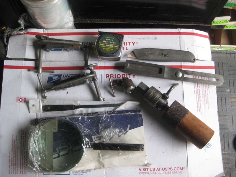 lot of tools , clamp , chuks, and