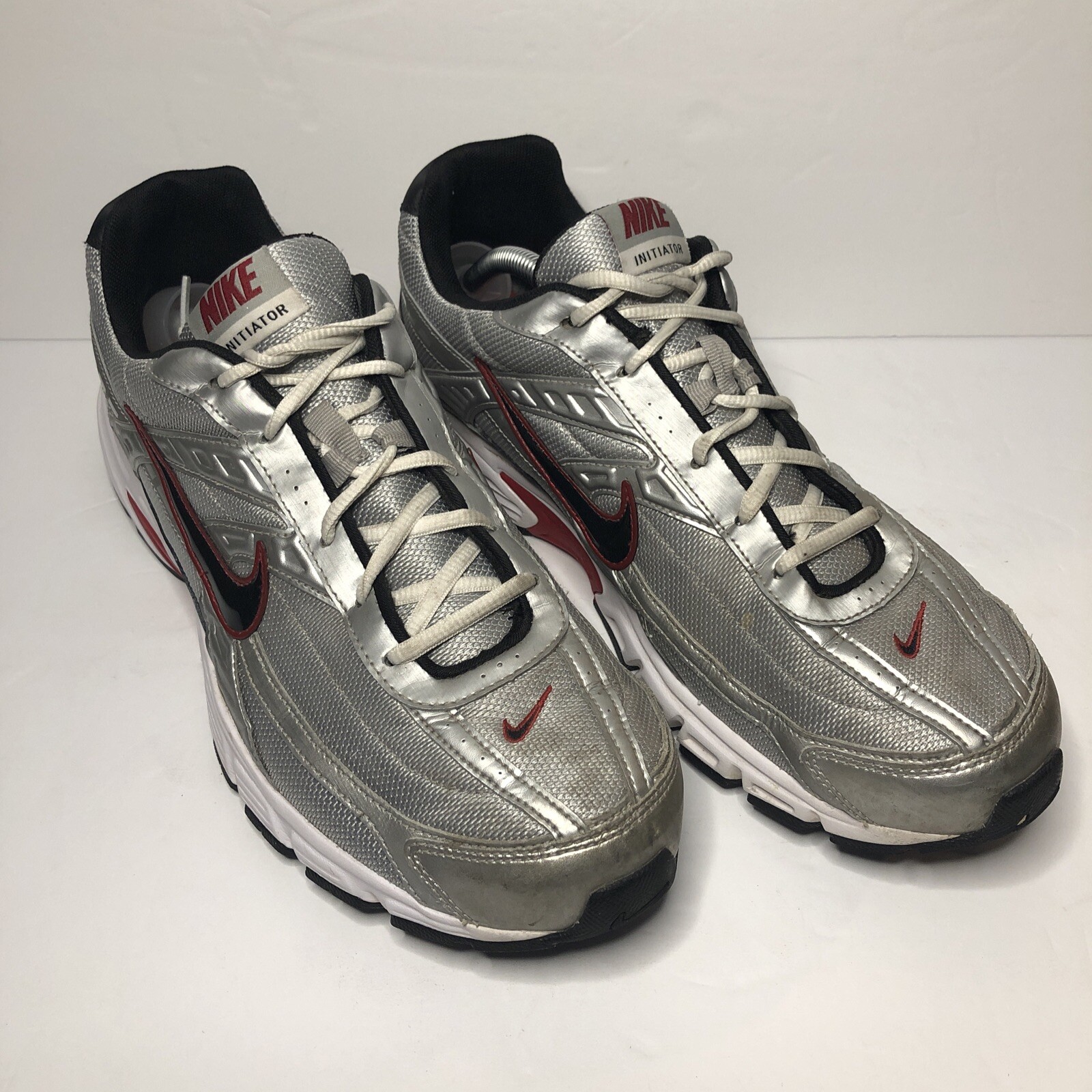 nike initiator silver