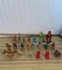 Preowned Dinosaur Toy Lot of 21 with a Jeep and 1 man.Various Sizes..Check Pics.