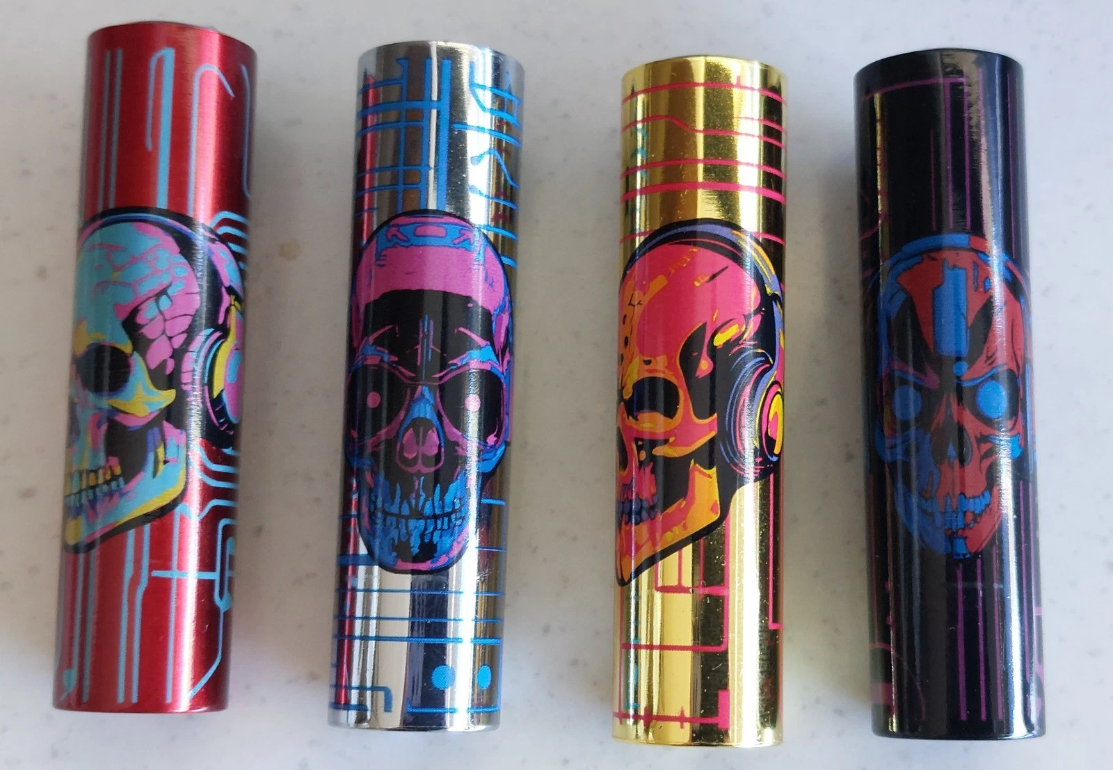 Clipper 4 x Micro Refillable Lighters collectable in metal skull cases - Picture 1 of 2