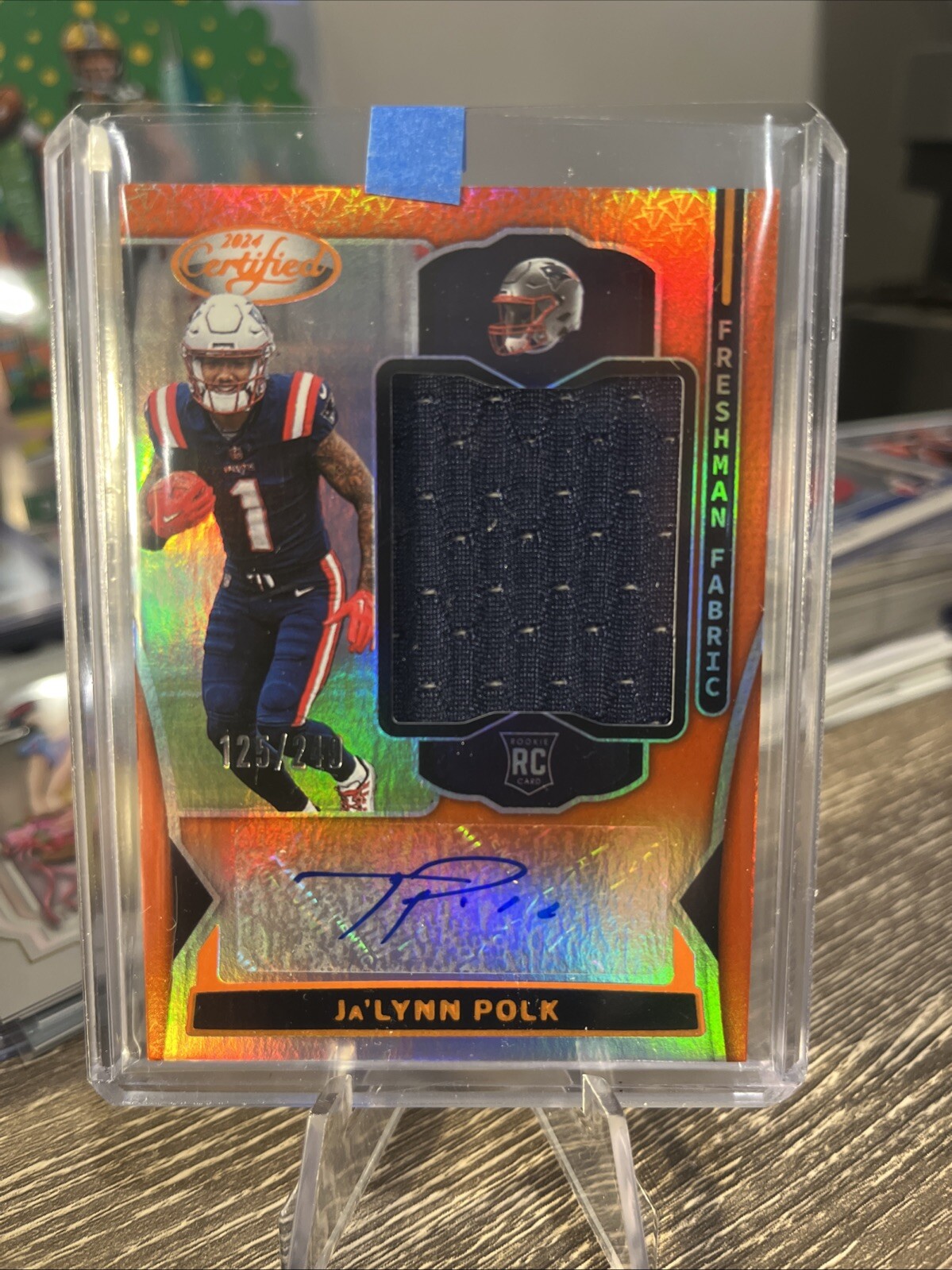 2024 PANINI CERTIFIED RC JA'LYNN POLK FRESHMAN FABRIC JERSEY AUTO Orange /249