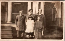 Postcard Real Photo RPPC Husband wife and Children Outside House