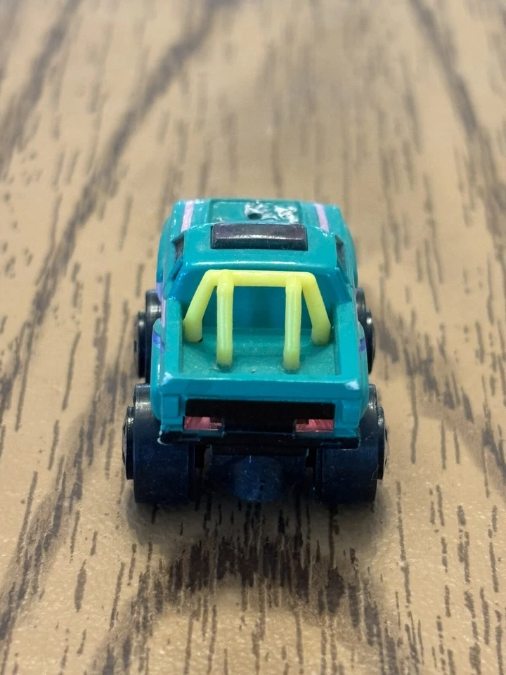 VTG 1986 Micro Machines Datsun 4x4 Off Road Pick Up Truck Green Pink Stripes - Image 3 of 4