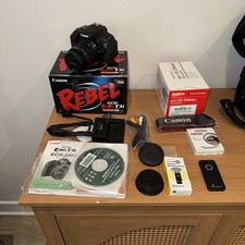 Canon EOS Rebel T3i DSLR Camera plus lens, case, charger, remote, boxes