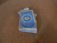 Vintage Del la rue playing cards still with partial tax seal rose emblem on back