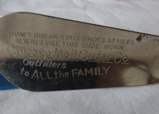 2 VINTAGE SHOEHORNS 1 PLASTIC 1 METAL CHICAGO MAIL ODER CO. TO ALL THE FAMILY