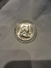1957 50C Silver Franklin Half Dollar In Capsule