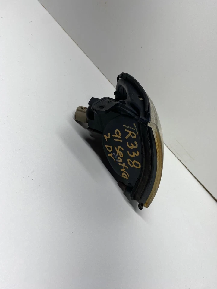 91-92 NISSAN SENTRA LUZ DE ESTACIONAMIENTO IZQUIERDA INTERMITENTE GUARDABARROS MONTADO OEM, 116-58259 Foto 2 de 4