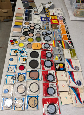 Large lot of 100+ Camera filters and accessories- vintage brands, sold as is