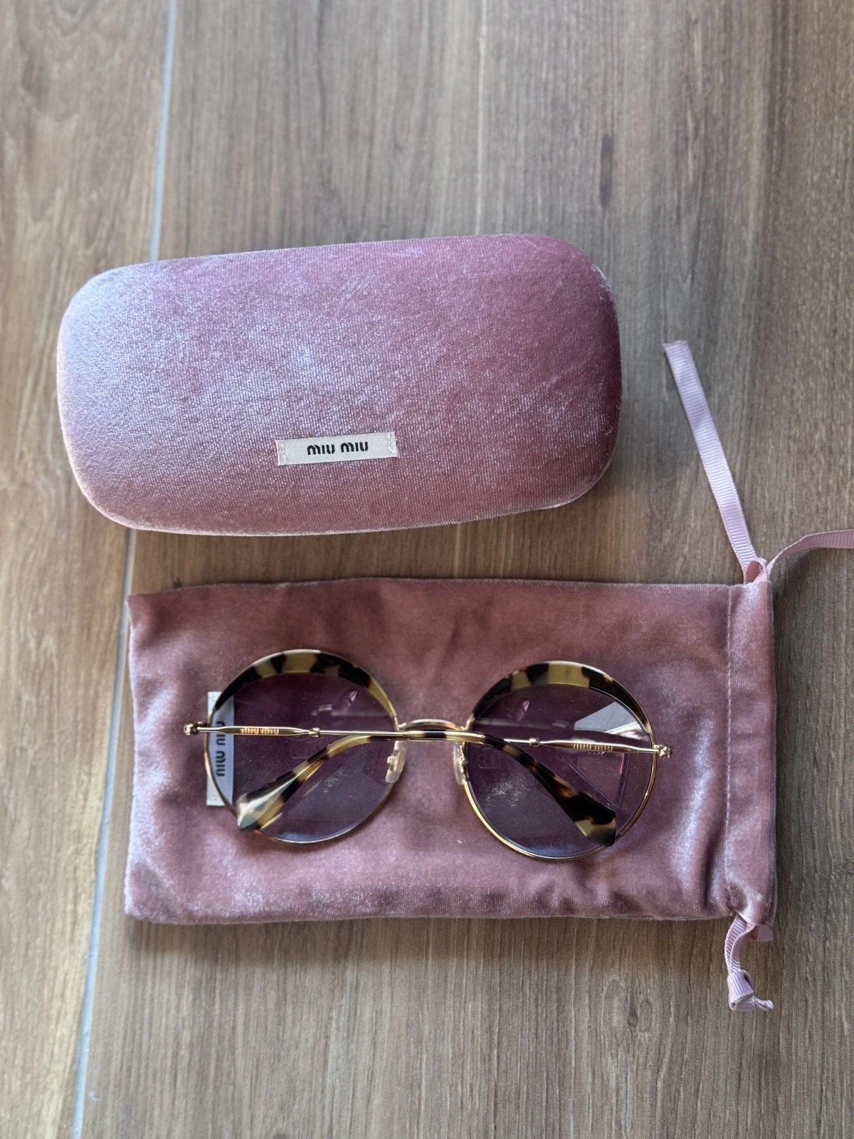 Occhiali da sole rotondi Miu Miu