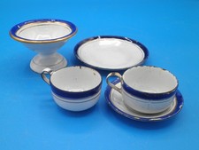 Five piece childs doll blue white gold granitware tea set sugar cups saucers