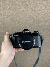 Canon AV-1 fotocamera reflex nera con obiettivo Cosina 28mm f/2.8 custodia cinghia testata funzionante