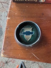 Vintage 1950s Chevy Steering Wheel Horn Cap Button Green Background Vintage 1950s Chevy Steering Wheel Horn Cap Button Green Background