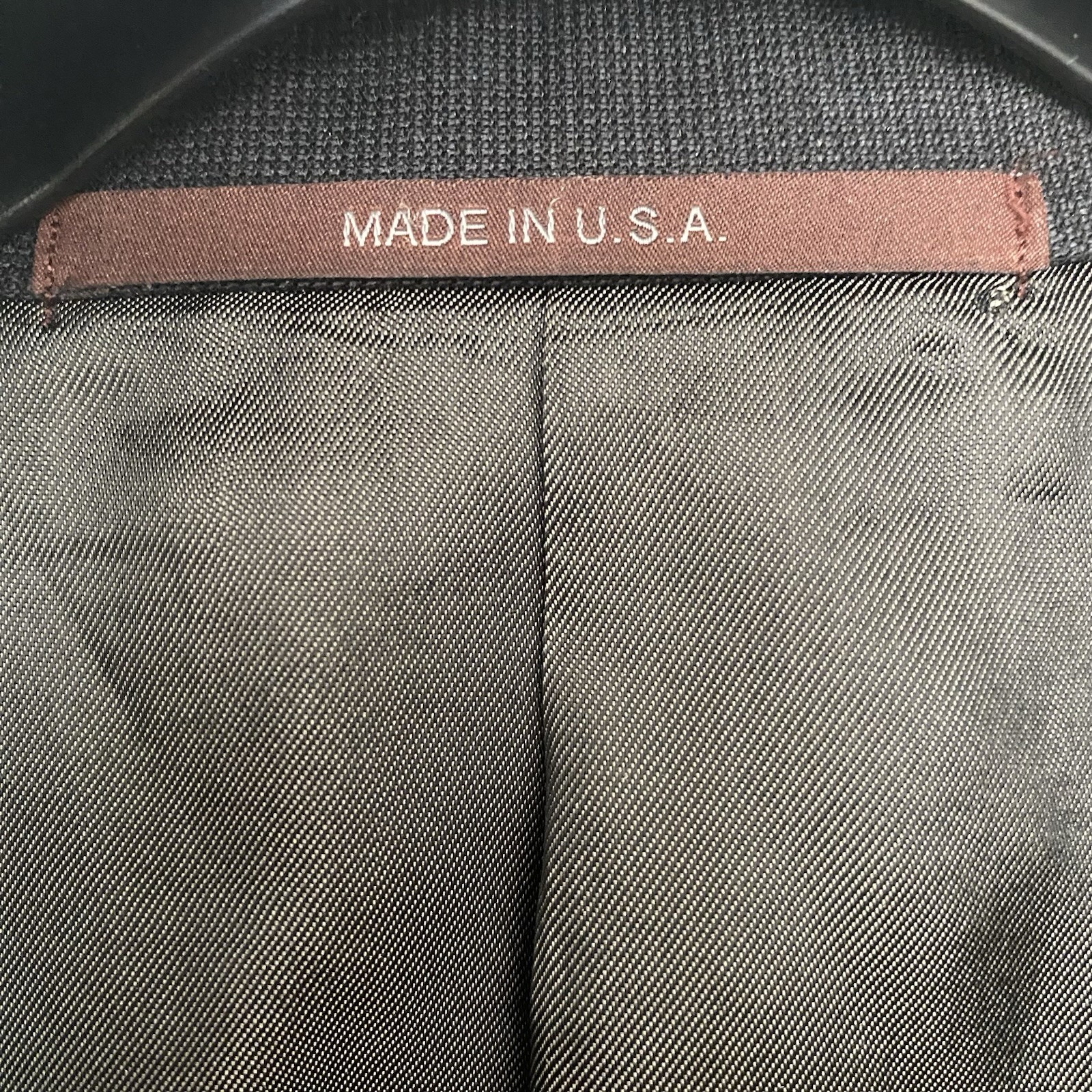 Hickey Freeman men's 100% Super 130’s worsted wool blazer with notch lapel, four-button front, and subtle textured fabric.