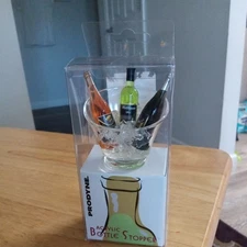 Prodyne Acrylic Bottle Stopper Three Wine Bottles Chilling in An Ice Bucket