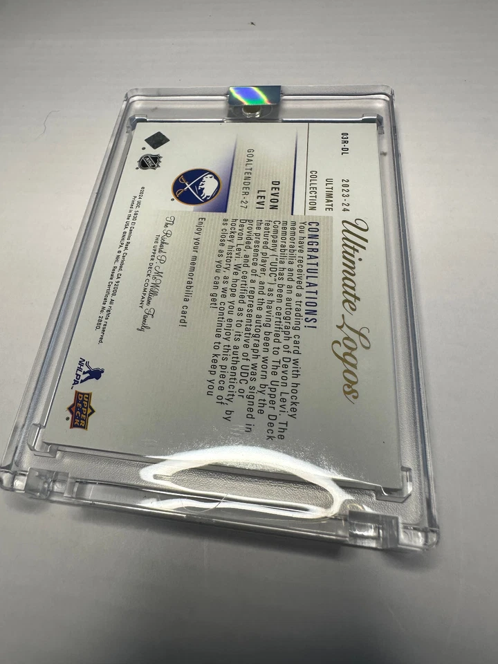 23-24 Ultimate Collection Devon Levi GOLD Ultimate Logos Rookie Auto /49 03R-DL - Image 2 of 2