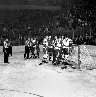 Gordie Howe shown standing by as linesman Ant Skov restrains Lou F- Old Photo