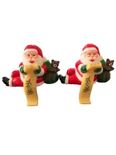 Vintage SANTA CLAUS Checking His List Stocking Hanger Holder Set 2