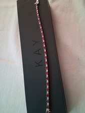 Kay Jewelers Garnet and Sterling Silver Tennis Bracelet 7.25in. Never worn/used.