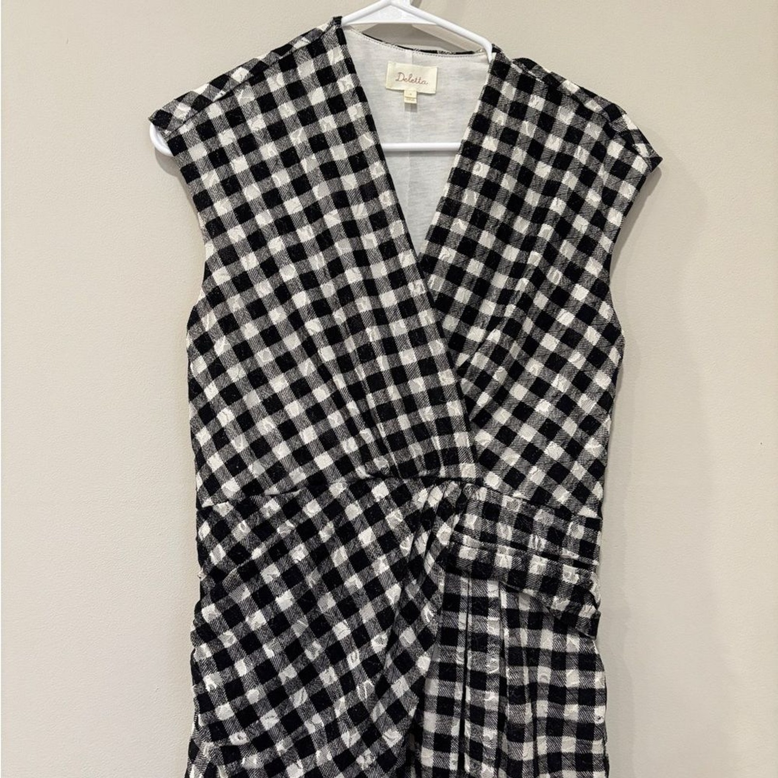 Deletta (Anthropologie) women’s size Small black/white peplum top