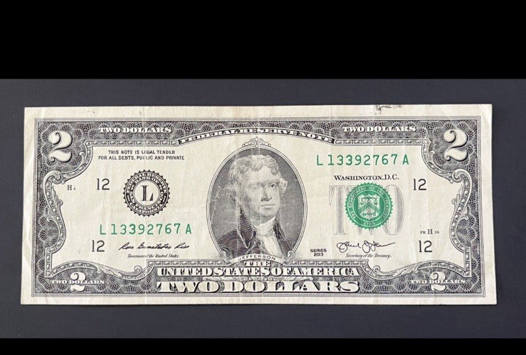 ERROR $2 DLL BILL - OVERINK ON SERIAL #: "3" & WET INK TRANFER ON MARGINS, CIRC.