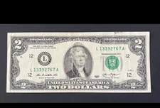 ERROR $2 DLL BILL - OVERINK ON SERIAL #: "3" & WET INK TRANFER ON MARGINS, CIRC.