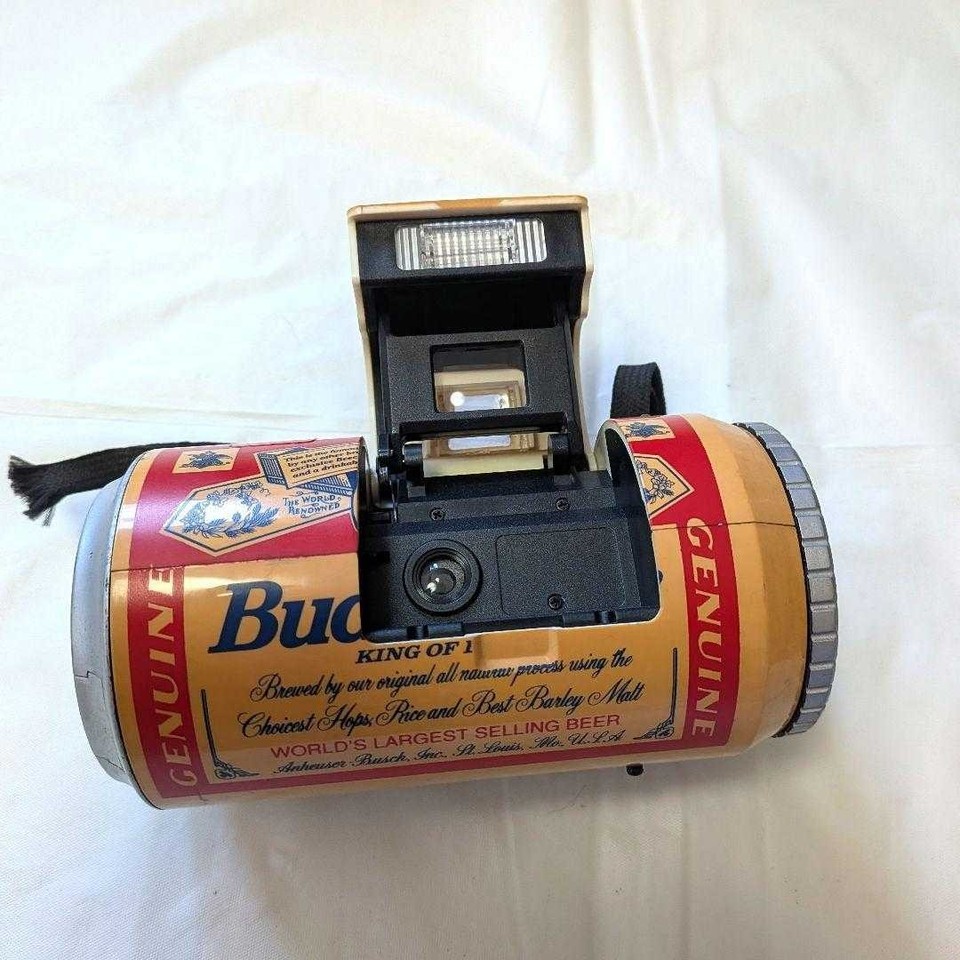 A working 35mm film camera disguised as a Budweiser beer can — pure novelty Americana made in Japan at peak advertising kitsch.