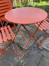 Orange Metal Folding Round Garden Table . 2 Chairs pick up South Leeds