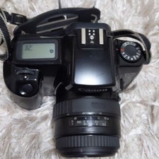 Canon EOS1000S Black Film Camera with Long Lens for Collectors and Enthusiasts