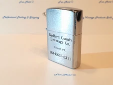 NEVER FIRED FLIP TOP BEDFORD COUNTY BEVERAGE Co. ADVERTISING LIGHTER  [3609]