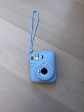 Blue Instax Mini 12 Polaroid camera