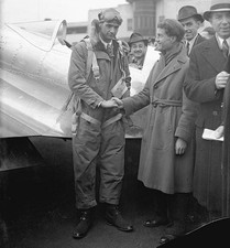 Howard Hughes Sportsman pilot is greeted by Dick Palmer on former'- Old Photo