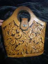 vintage hand-tooled leather bucket handbag, typical of Mid-Century Western