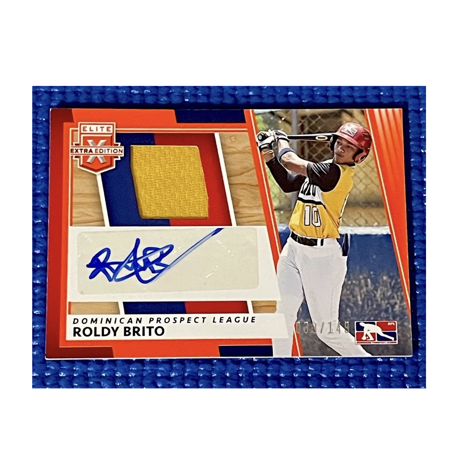 2022 Panini Elite Extra Edition Roldy Brito DMS-RB Auto Mem Orange /149 RC
