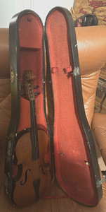 Antique violin and wooden coffin case