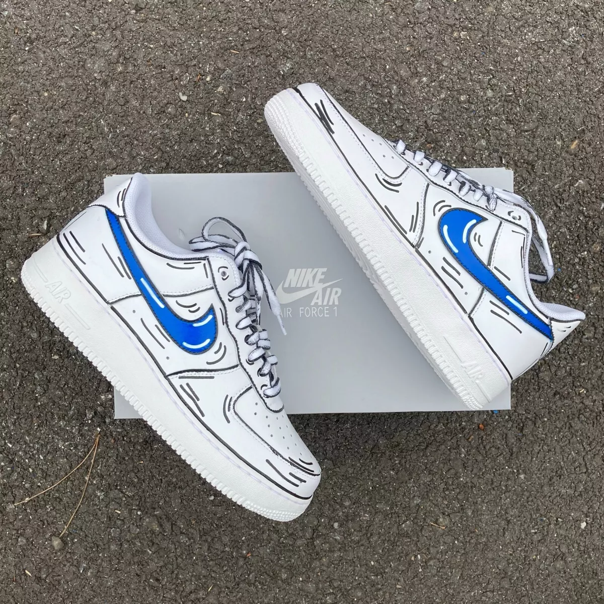 Custom Air Force 1s with light blue and navy 3D Nike Swoosh