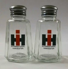 A Nice Set of International Harvester Salt & Pepper Shakers 3¾" Tall