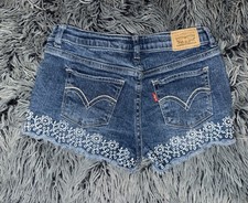 Levi's girl's blue denim shorty shorts, white flower embroidery at hem, sz 12