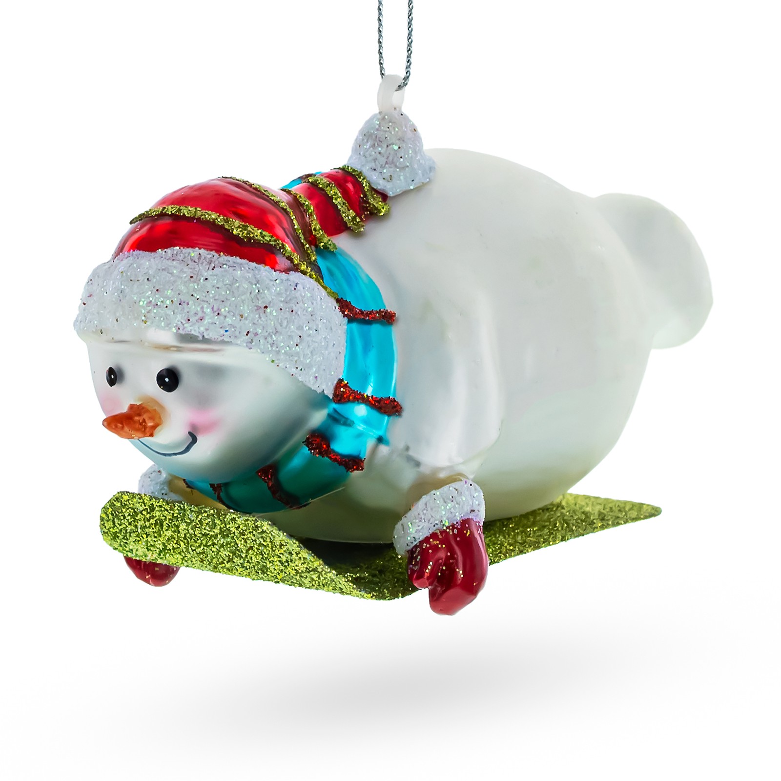 Snowman Gleefully Riding a Sled Glass Ornament