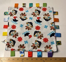 Taggies Monkey Pirate Lovey Navy Blue Backing With Multiple Colors Tags