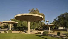 Mushroom-like shelters that accent the round motif of an adjacent branch of a
