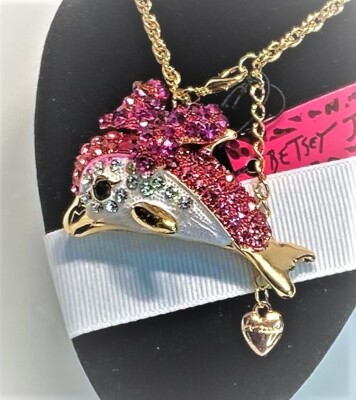 BETSEY JOHNSON  PENDANT A GOLD DOLPHIN HAS CRYSTALS & ENAMEL  A GOLD CHAIN & TAG