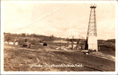 #ad RPPC Oil Wells Reed City MI Field Real Photo 1945 Cars Derricks Postcard $10.00