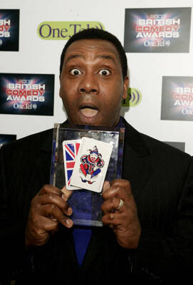 Comedian Lenny Henry poses in the pressroom at British Comedy Awar- Old Photo 1